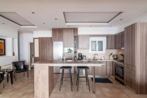 Kuchyň nebo kuchyňský kout v ubytování Kleio by Heloni Apartments