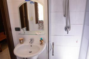 Koupelna v ubytování Hotel Merlino