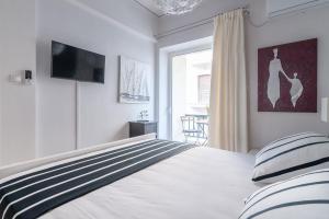 Postel nebo postele na pokoji v ubytování Kleio by Heloni Apartments