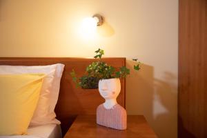 Postel nebo postele na pokoji v ubytování Hotel Merlino