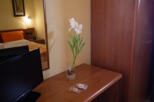 Postel nebo postele na pokoji v ubytování Hotel Merlino