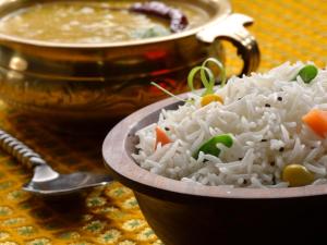 a bowl of rice and a bowl of soup at Mountain Village Stay - Dharali Heights Harsil in Harsil