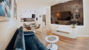 Televízia a/alebo spoločenská miestnosť v ubytovaní Apartament Silence Triventi Szmaragd