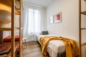 a bedroom with a bed and a bunk bed at Emilia Suite Young in Modena