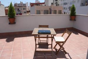 a table and two chairs on a roof at Residencia Mayol - Adults Only in Palma de Mallorca