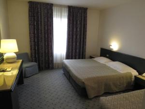 Postel nebo postele na pokoji v ubytování Hotel Turandot + 30 fotografií