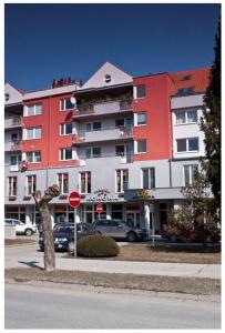 a large building on the side of a street at Pension Korona in Púchov