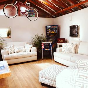 a living room with a bike hanging from the ceiling at Remington Flats in Fort Collins