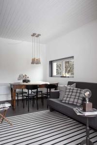a living room with a couch and a table at IRIS TOP 3 DESIGN APARTMENT in Bad Kleinkirchheim