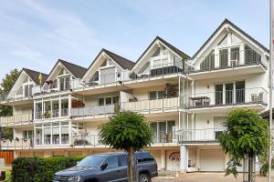 a van parked in front of a large building at Ferienwohnung Bella Vista Premium Appartement in Bernkastel-Kues