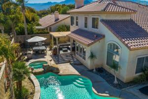 an aerial view of a house with a swimming pool at The Playa in Indio