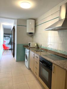 A kitchen or kitchenette at Playa de Levante Sea View Apartment