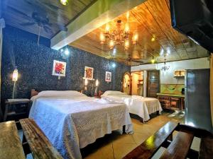 Postel nebo postele na pokoji v ubytování Hotel Costa Verde