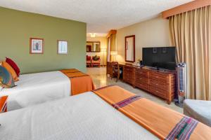 Ένα ή περισσότερα κρεβάτια σε δωμάτιο στο Porta Hotel del Lago