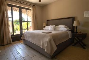 En eller flere senge i et værelse på Viñedos San Lucas