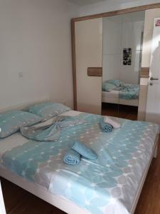 Postel nebo postele na pokoji v ubytování Apartman DODO 1