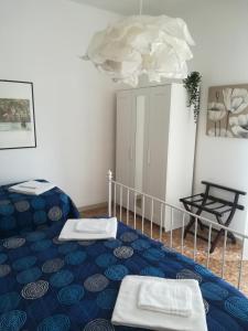 ヴェローナにあるBlunotteのベッド1台(タオル2枚付)が備わる客室です。