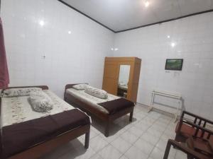 Rúm í herbergi á Hotel Paviljoen