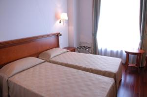 Postel nebo postele na pokoji v ubytování Pilgrim's Hotel