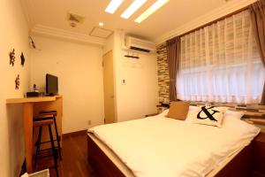 TV a/nebo společenská místnost v ubytování Hotel 3 O'Clock Tennoji
