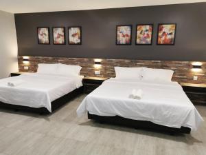 Voodi või voodid majutusasutuse L Hotel toas