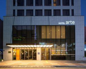 a building with a hotelrite sign in front of it at Hotel Arte in Suwon