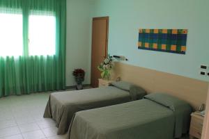 Postel nebo postele na pokoji v ubytování Hotel Minerva + 37 fotografií