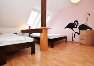 Posteľ alebo postele v izbe v ubytovaní Flamingo Apartments