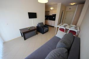 A television and/or entertainment centre at Menada Grand Kamelia Apartments