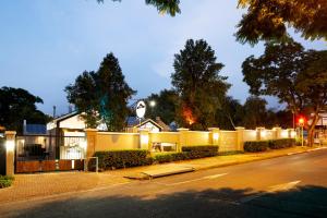 a house with lights on the side of a street at Clico Boutique Hotel in Johannesburg