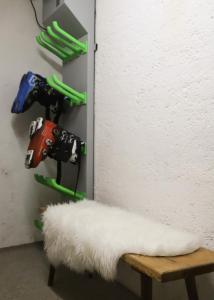 a room with a bench and a shelf with tools at Pension Mühlbauer in Bayrischzell