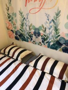 Postel nebo postele na pokoji v ubytování Tourism B&B