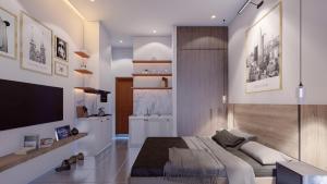 a bedroom with a large bed and a flat screen tv at GEM Apartment in Ho Chi Minh City