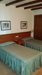 Кровать или кровати в номере Hotel Rural Casares