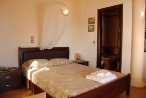 Postel nebo postele na pokoji v ubytování Corfu Maisonettes Anemouri - San George Apartments