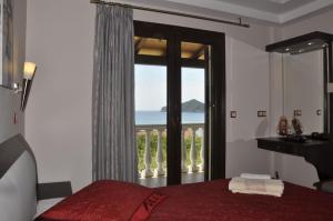 Postel nebo postele na pokoji v ubytování Corfu Maisonettes Anemouri - San George Apartments