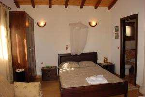 Postel nebo postele na pokoji v ubytování Corfu Maisonettes Anemouri - San George Apartments
