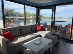 a living room with a couch and a table at Hausboote Marina Braunsbedra in Braunsbedra