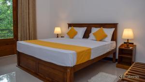 Postel nebo postele na pokoji v ubytování Gal Oruwa Resort