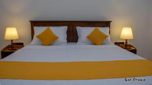 Postel nebo postele na pokoji v ubytování Gal Oruwa Resort