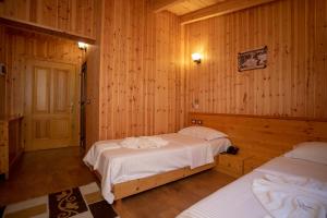 Hotel Shpija e Gjyshit客房内的一张或多张床位