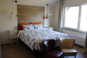 Katil atau katil-katil dalam bilik di Villa Kakelbont Borgloon