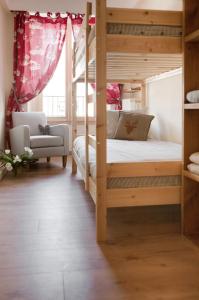 Ліжко або ліжка в номері Appartement Le Lutetia