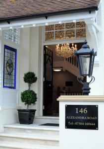 a building with a sign in front of a door at Tower Apartments in Southend-on-Sea