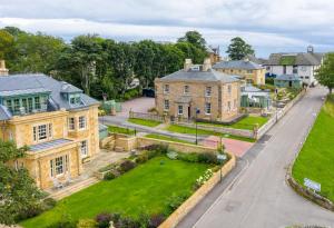 an aerial view of a house with a yard at Links House at Royal Dornoch in Dornoch