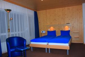 Lova arba lovos apgyvendinimo įstaigoje Hotel Alpha