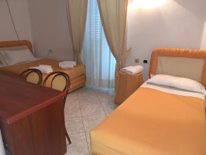 Een bed of bedden in een kamer bij Il Cinghialetto