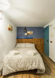Giường trong phòng chung tại La posada del Cani