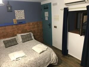 Posteľ alebo postele v izbe v ubytovaní La posada del Cani