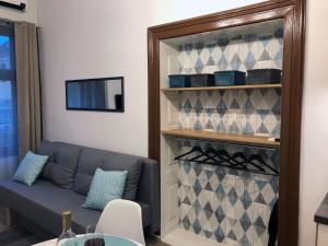 a living room with a couch and a wine rack at IL-LAK Apartment in Pannonhalma